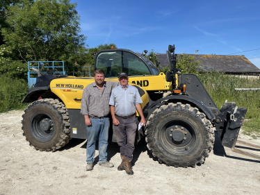 James with a local tractor dealer